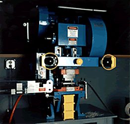 Die cutting press in operation